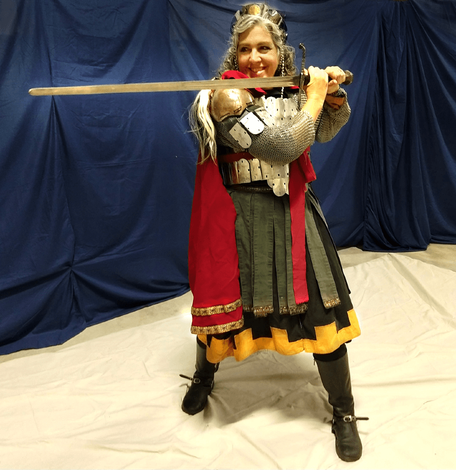 A woman in medieval armor wielding a sword