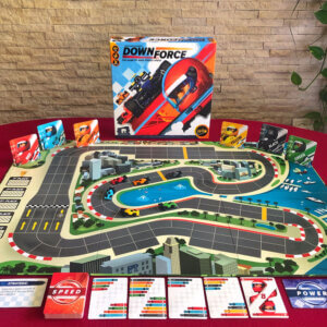 downforce auto racing board game from restoration games components spread out on table