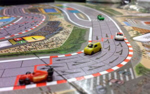 miniature cars on racetrack game board of formula d auto racing board game from asmodee