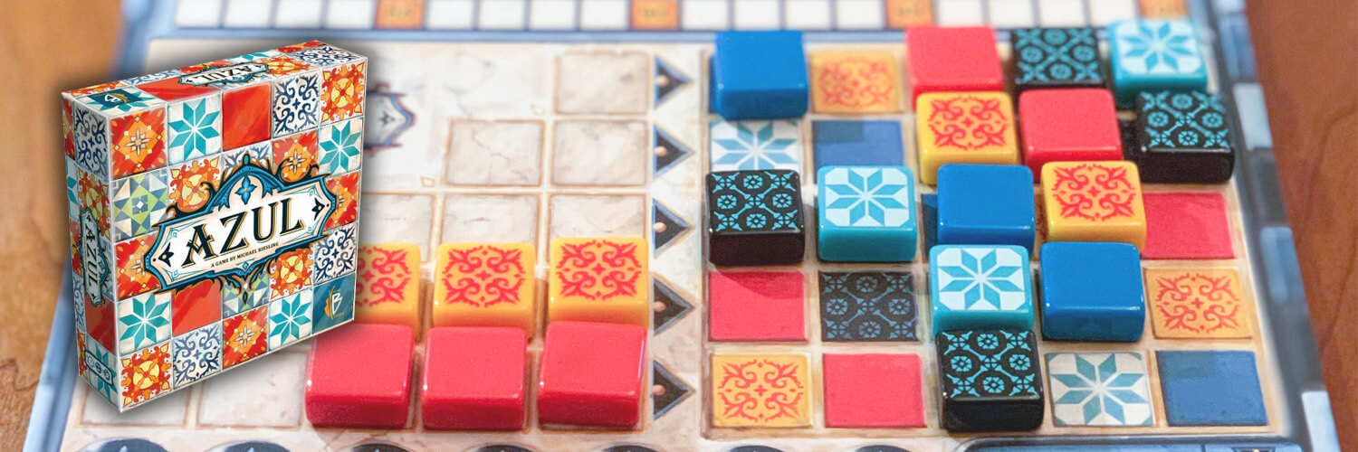 Azul board game box set on top of a player board loaded with decorative tile pieces