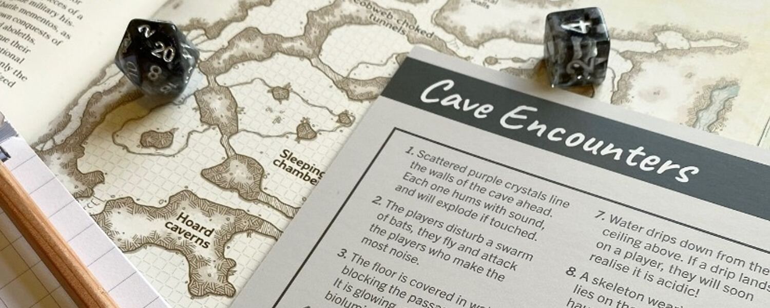 two polyhedral dice sitting on a fantasy rpg map with a random table of cave encounters from Roll & Play Press