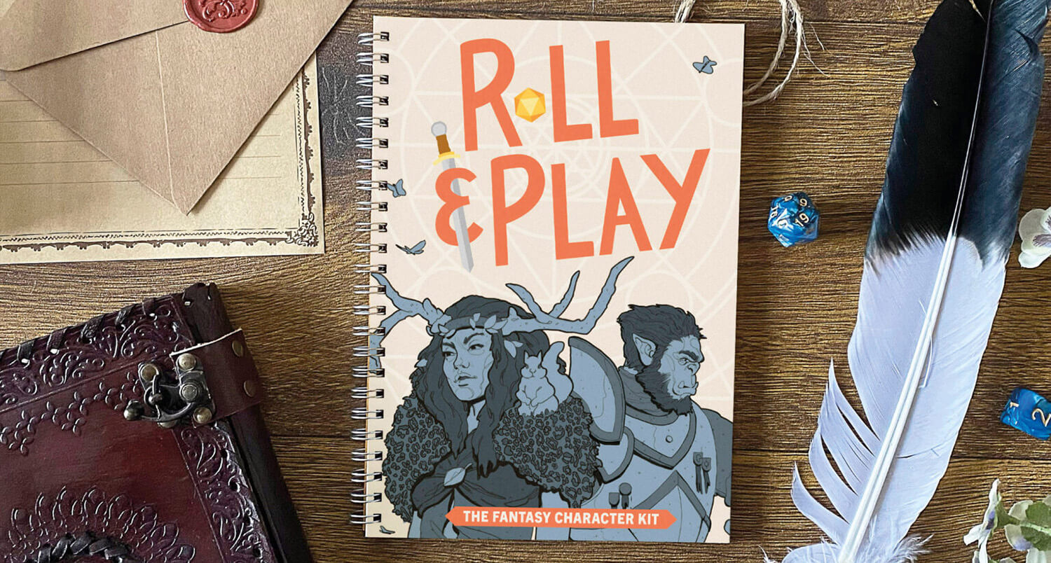 Roll & Play Press' Fantasy Character Kit book on a wooden table with a decorative leather-bound book, polyhedral dice, twine, and a feather