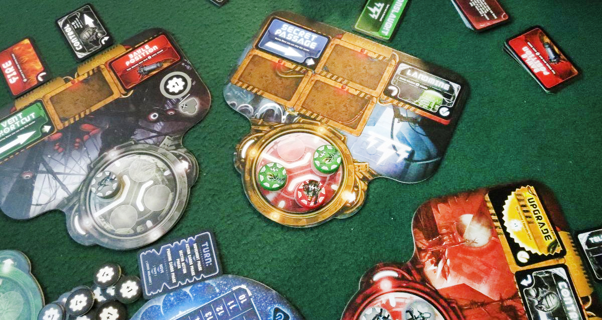 components for the board game Theseus: The Dark Orbit on a green game table