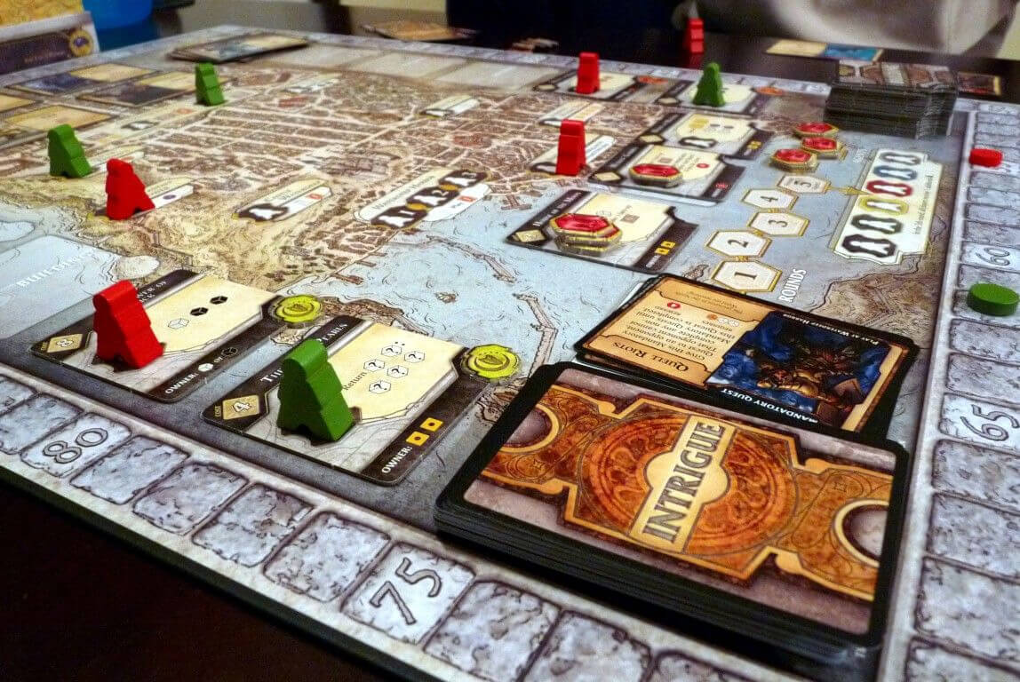 lords of waterdeep game baord with meeple and cards