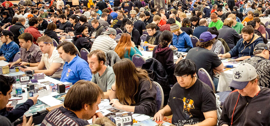 crowd of people playing Magic the Gathering at one of the official Grand Prix events