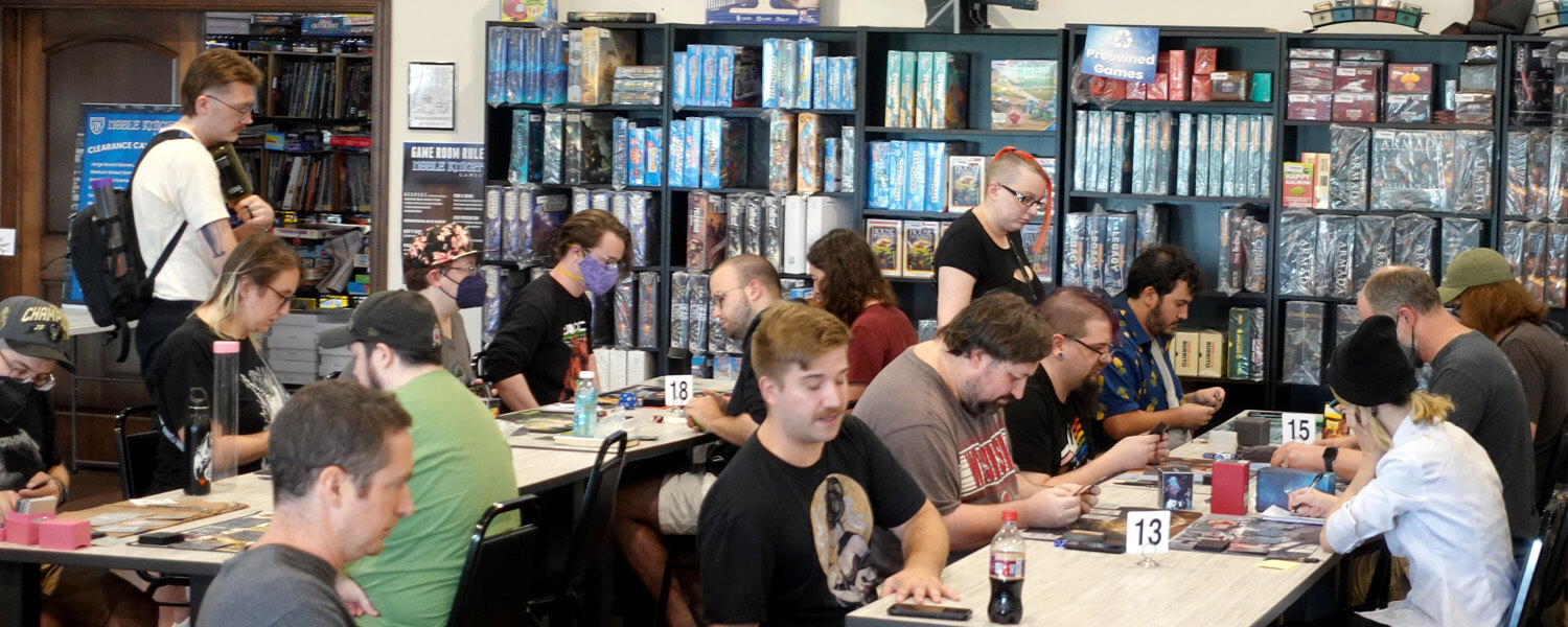 People playing at one of Noble Knight Games' large Magic events