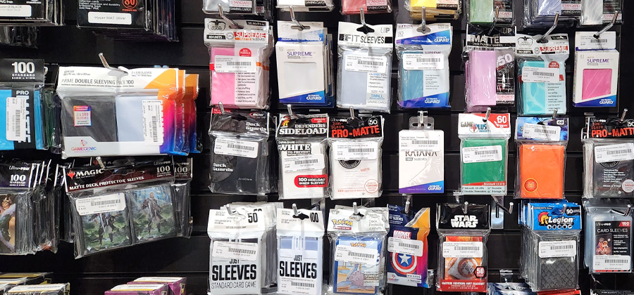 store rack of different brands of card sleeves