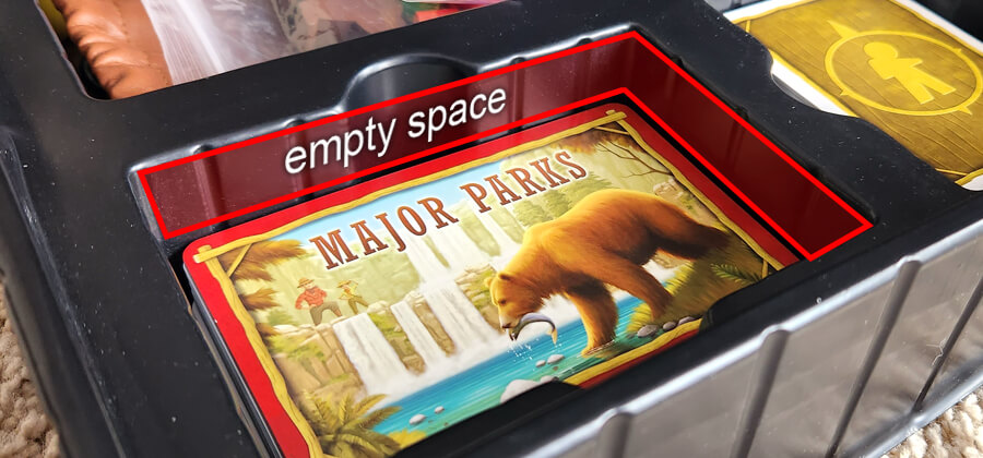 closeup photo of a black, plastic default game inserts featuring a space too large for the components